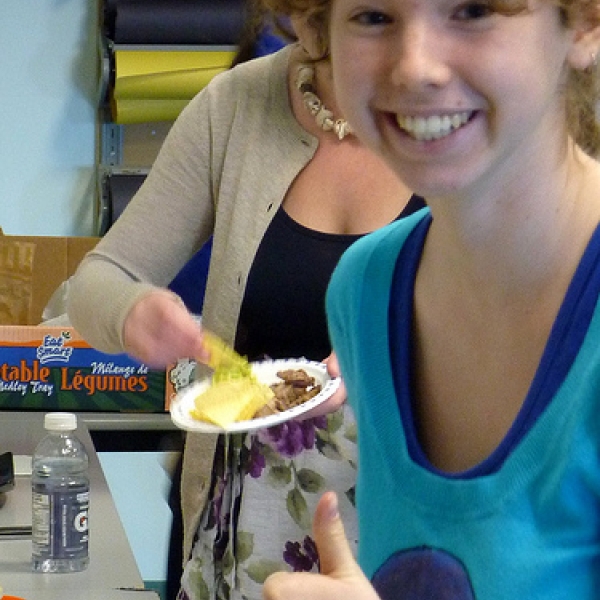 Thumbs up! Celia gives a thumbs up to the munchies provided for the ANTH Forum.