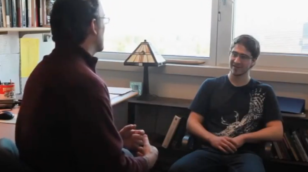 LBST professor conferring with student in office hours