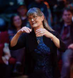 Woman conducting a band.